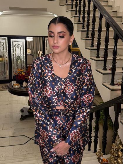 Glowing this Diwali, inside and out. Aishani's stunning bronze makeup and soft pink pout are the epitome of festive chic. This look captures warmth, elegance, and joy.