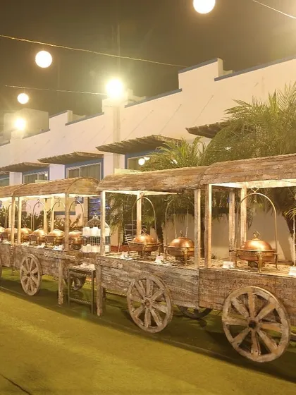 Our unique rustic cart buffet setup adds a charming and memorable touch to outdoor events and farmhouse parties, blending style with exceptional food service.