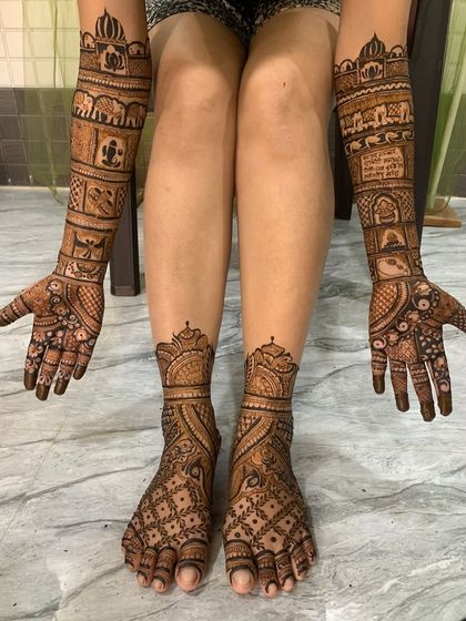 Another example of our full bridal package. The hand and foot mehndi designs complement each other, featuring similar motifs like palace architecture and elephants.