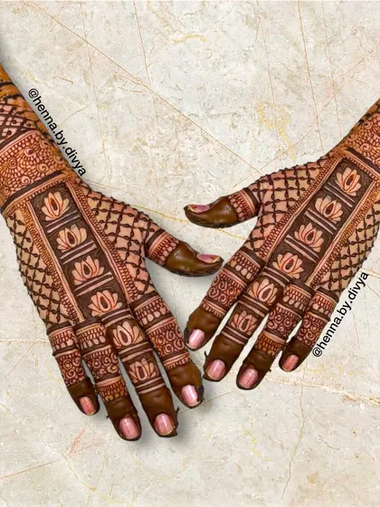 A unique back-hand design with a vertical band of lotus motifs running down the center, framed by a delicate grid pattern.