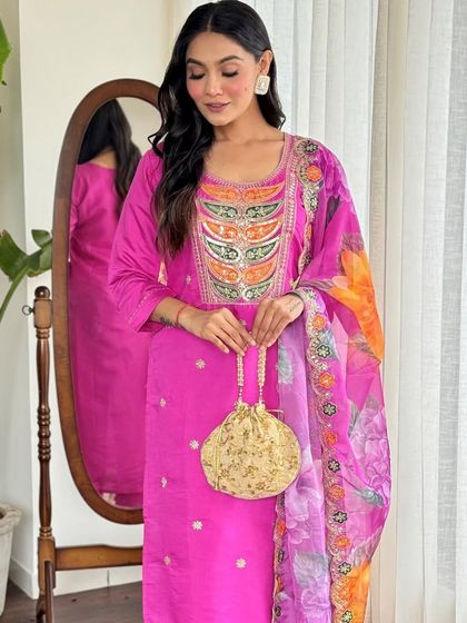 This rani pink kurta pant set is a festive dream. The heavy thread embroidery and sequin work make it a glamorous choice for any celebration.