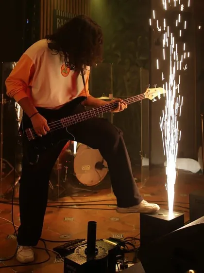 Our bassist grooving to the rhythm of life, with a cold pyro adding to the drama.
