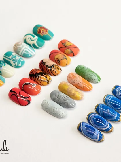A collection showing swirl art created with acrylic powder and the sea effect technique.