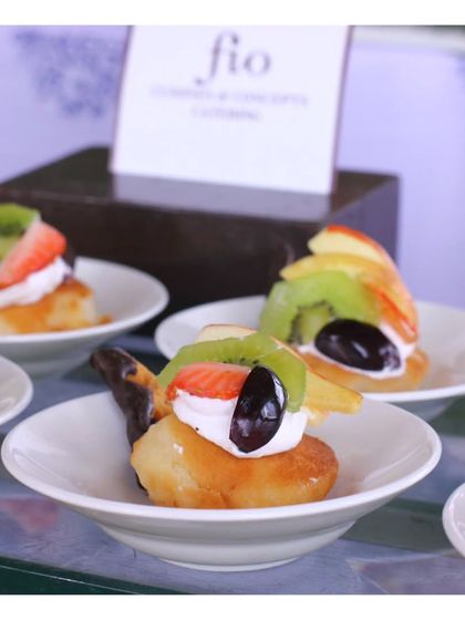 A delicate dessert canapé featuring a caramelized fruit topping on a light pastry base. Our small bites extend to the dessert course, offering a variety of sweet endings.