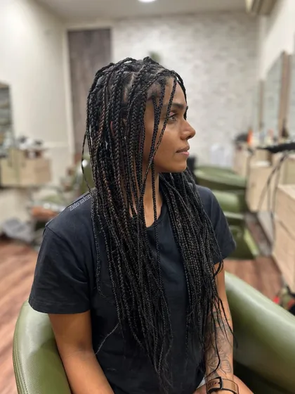 Here is a classic set of long box braids. The real beauty of braiding is in the conversation we have with you. We talked through her personal journey and created a style that reflects her personality, no Pinterest board needed. We also make sure you leave knowing all the braid aftercare tips to keep them looking fresh.