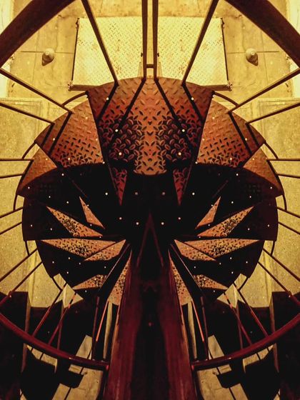 A creative interpretation of the iconic red spiral staircase at 1 Shanthi Road, an art residency I designed. This image captures the structure's dynamic, sculptural quality, seeing it as a 'feminine deity' or an otherworldly creature.