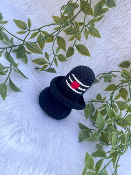 This is the crochet Shivalinga I made as part of a divine set. It is crafted in black yarn with the sacred markings, creating a simple yet powerful spiritual symbol.