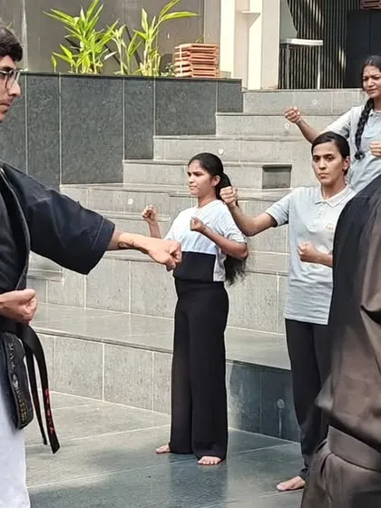 I offer practical self-defense workshops for schools and colleges. Here, my instructors are guiding female students at ISBR Business School through basic techniques, focusing on awareness and escape strategies for real-world safety.