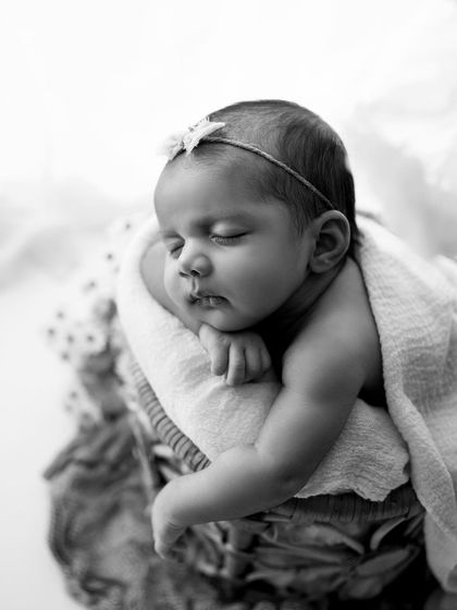 A timeless black and white conversion of a baby sleeping in a basket. Black and white photos have a way of highlighting emotion and texture so beautifully.