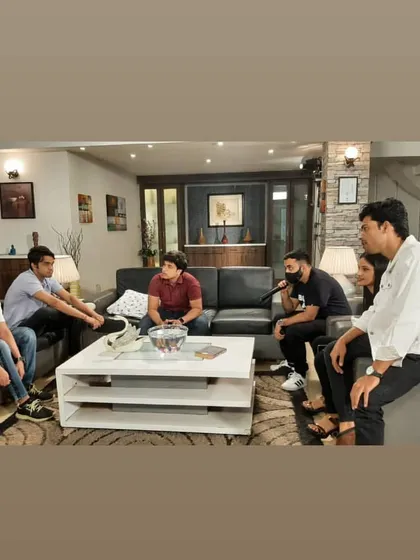 The cast and crew discussing a scene. Collaboration is everything in this field, and I always make sure to work closely with the director and the entire mandali to get the perfect shot.