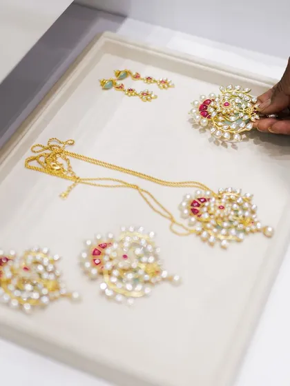 A tray of exquisite jewels from the Suneet Varma collection, ready to be explored by guests at our private showcase.