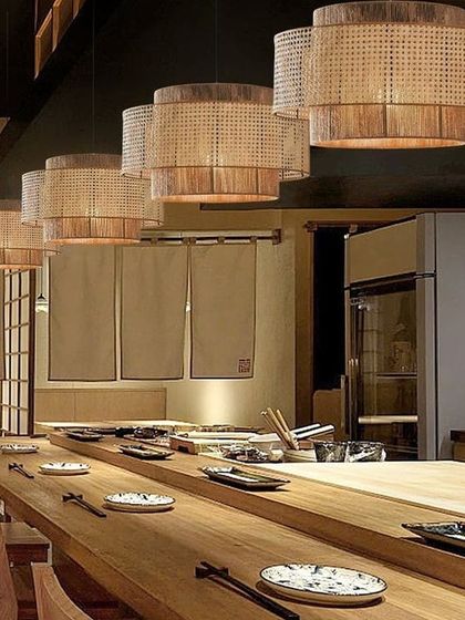 A series of our tiered rattan chandeliers installed in a Japanese-style restaurant. The natural texture of the lamps complements the wooden furniture and minimalist decor, enhancing the serene and sophisticated ambiance of the space.