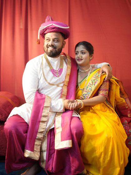 For a traditional pre-wedding shoot, this couple chose our classic Marathi outfits. The groom is wearing a white sherwani with a pink dhoti and pheta, available for rent.