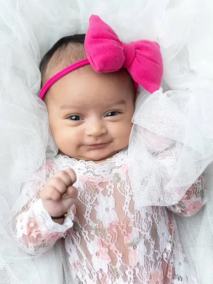 A beautiful, happy smile from an awake newborn. It takes patience, but capturing these expressions is incredibly rewarding.