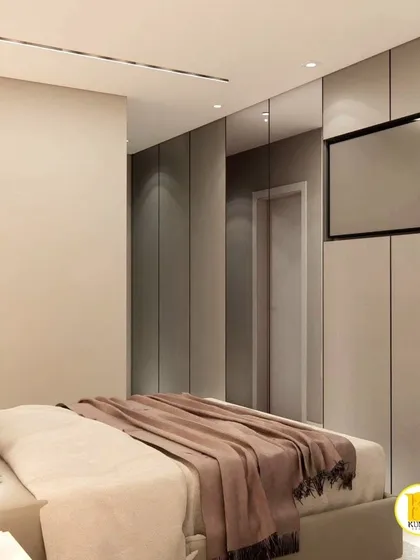 This view shows the TV mounted on the wardrobe panel, a clever space-saving solution.