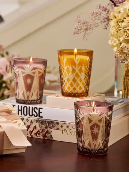 The Royal Ember candles bring a soft, radiant glow to any space. Crafted in intricately cut glass, this elegant duo is available in two ethereal colors: a sensuous Blush and a celebratory Gold. They are perfect for festive gatherings or as a luxurious home decor accent.