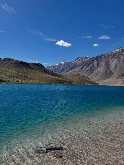 The crystal clear, turquoise water of Chandratal Lake, the 'Moon Lake'. This is the grand prize at the end of the Hampta Pass trek.