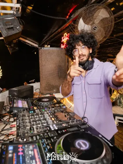 Pointing out to the crowd at Cafe Mambo. I make sure to interact with the audience, making them feel like a part of the show.