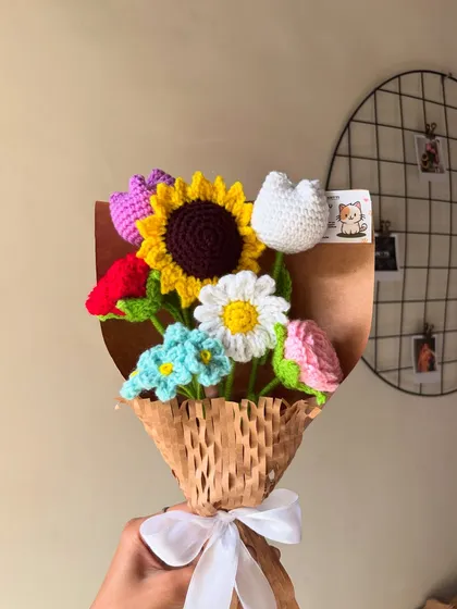 This vibrant mixed flower bouquet is a customer favorite. It features a sunflower, tulip, daisy, and rose, all handmade to last longer than any situationship.