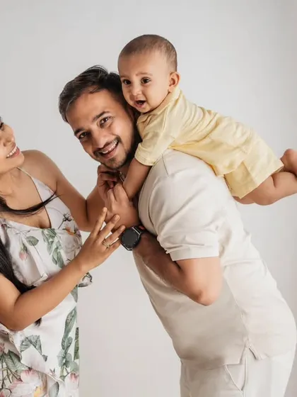 Capturing the fun and energy of toddlerhood! This playful studio shot of a father with his son on his shoulders is all about capturing authentic, happy moments that show a family's unique bond.