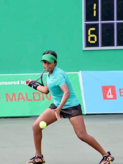 Captured in action during a competitive match, our player demonstrates the agility and powerful forehand that led her to become a national champion in the Maldives.