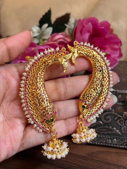 A pair of fish-motif Karnaphool with intricate net-like 'jaali' work. This is a unique and traditional design.
