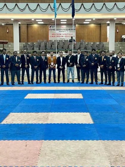 A series of photos showing the dedicated group of officials, judges, and technical committee members from the North East Zone & All India University Karate Championship. It takes a large, coordinated team to run a successful national-level event.
