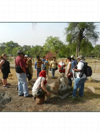 Participants examine a tombstone in Nicholson Cemetery. Each grave tells a story, and our walk pieces together a larger narrative of colonial life and death in Delhi.