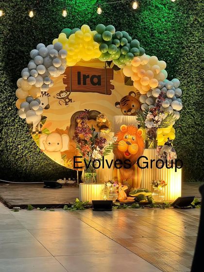 The jungle-themed stage setup at night, with lighting that highlights the decor and creates a magical ambiance.