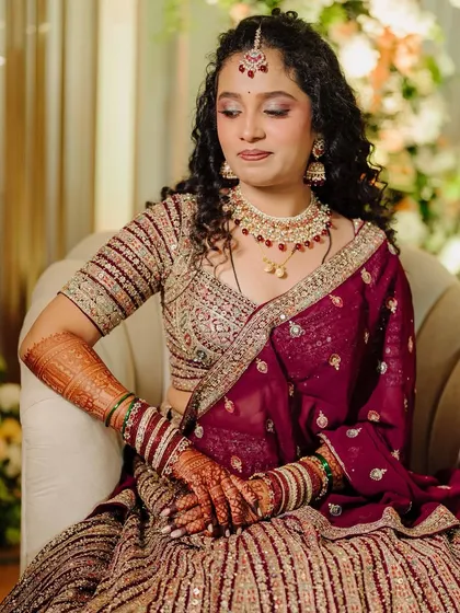The complete look, showing how the makeup, hair, and outfit come together for a cohesive and stunning bridal style.