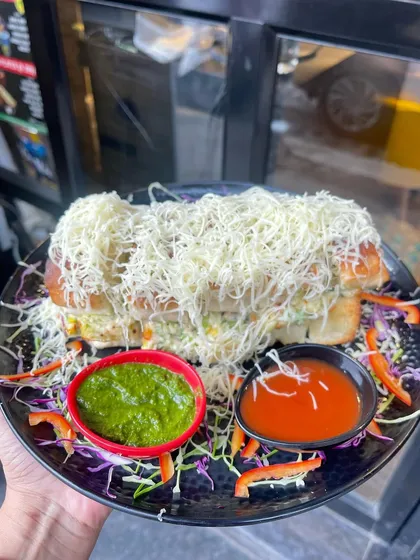 My Mumbai Bites Italian Sandwich is a meal in itself. It's a massive, triple-layered sandwich packed with fresh veggies and sauces, then grilled and loaded with a generous amount of cheese.