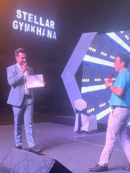 On stage at the Stellar Gymkhana for a Bureau Veritas family day event. Engaging with audience members directly is a key part of my corporate mentalism act.