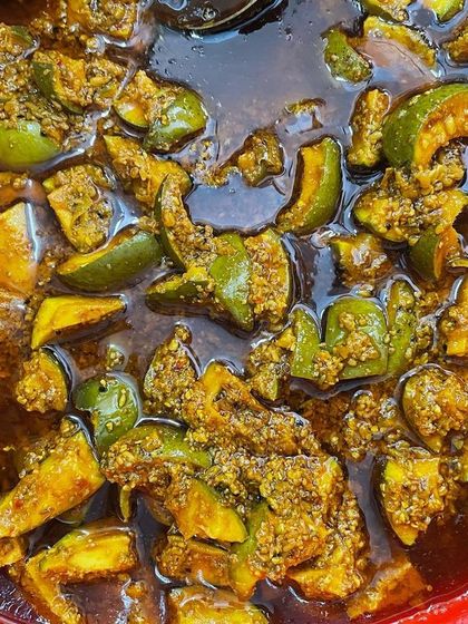 A close-up of my traditional oil-based mango pickle. The pieces are submerged in pure mustard oil with spices, which helps preserve the pickle and deepen its flavour over time.