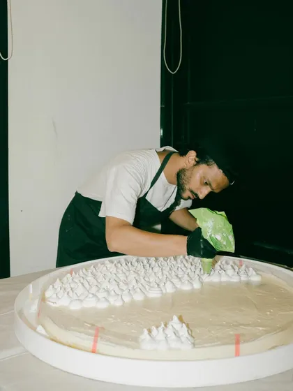 Our chef meticulously preparing the giant cake for Rohan's 30th. This behind-the-scenes shot shows the craft that goes into our most playful creations.