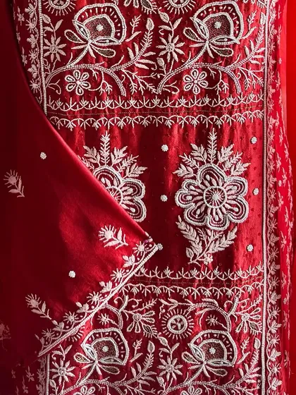 A detail shot of the kurta's front panel, highlighting the dense and intricate hand-embroidery.