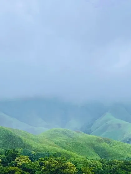 A misty view of the green hills, typical of the beautiful landscapes we explore.