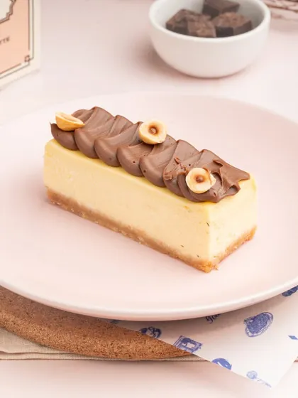 My New York Cheesecake is a timeless classic, but this one has a twist with a rich hazelnut chocolate topping.