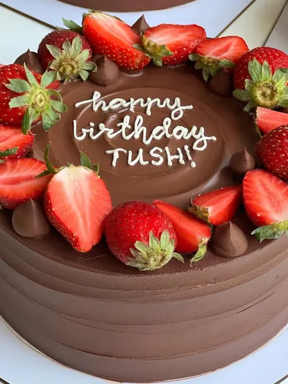 My classic Chocolate Strawberry cake, topped with fresh, juicy strawberries. It's a perfect balance of rich chocolate and bright, fruity flavor.