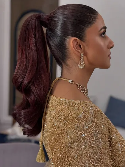 This sleek high ponytail is all about modern elegance. I focused on creating a super smooth base with a voluminous, wavy tail for a look that is both powerful and chic. It's a versatile style that works beautifully for a cocktail party or a contemporary reception look.