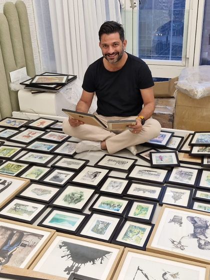 Interior design is all about making the right choices. Here I am, surrounded by a collection of art prints, carefully selecting the perfect pieces to bring a client's vision to life.