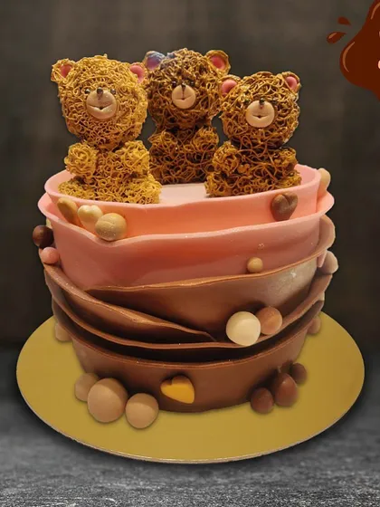 This charming cake is perfect for a teddy bear lover. It features intricate piped teddy bears on top of a chocolate-wrapped cake, combining cute design with delicious flavors.