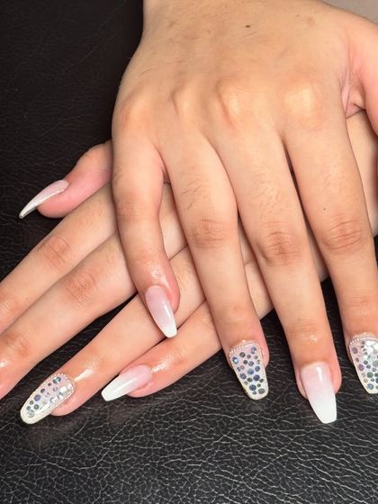 A final look at these flawless ombré extensions with stone accents, showing their clean shape and brilliant shine.