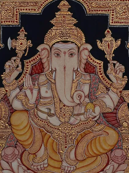 A classic portrayal of Lord Ganesha seated on a peetam (throne). The deep black background contrasts beautifully with the pure gold leaf embossing, highlighting his divine and powerful form.