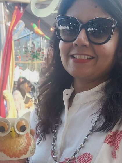 Me holding one of my favorite owl creations at The Lil Flea market. These pieces are always a conversation starter.