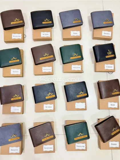 Here is a bulk order of personalized men's wallets I prepared as wedding return gifts. Each wallet was customized with a unique name and charm, and individually packed in its own box, ready to be gifted.