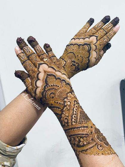 A crossed-hands pose to show the full effect of this intricate design.