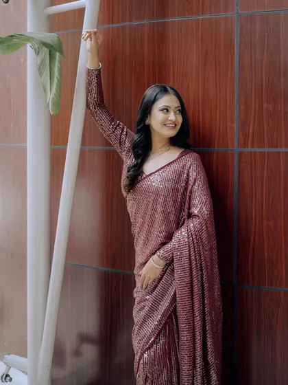 A full-length shot showcasing the stunning sequin saree and the bride's confident pose.