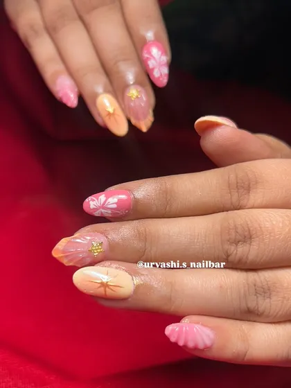 This trendy set combines multiple elements for a fun, summery vibe. It features sculpted shells, hand-painted florals, and starburst accents in a warm pink and orange color palette.