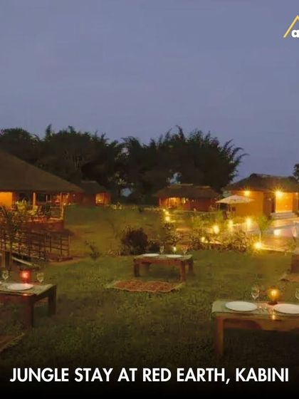 An evening view of Red Earth in Kabini, where you can enjoy outdoor dining with a view of the backwaters after a day of safaris.
