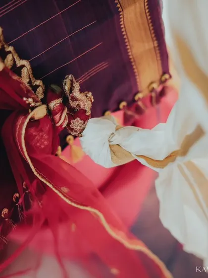 A detail shot focusing on the symbolic tying of the knot in a South Indian wedding. I believe these small, significant details are just as important as the grand moments.